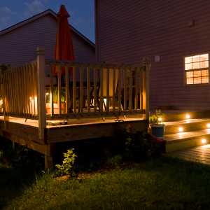 solar lights illuminating a wooden deck